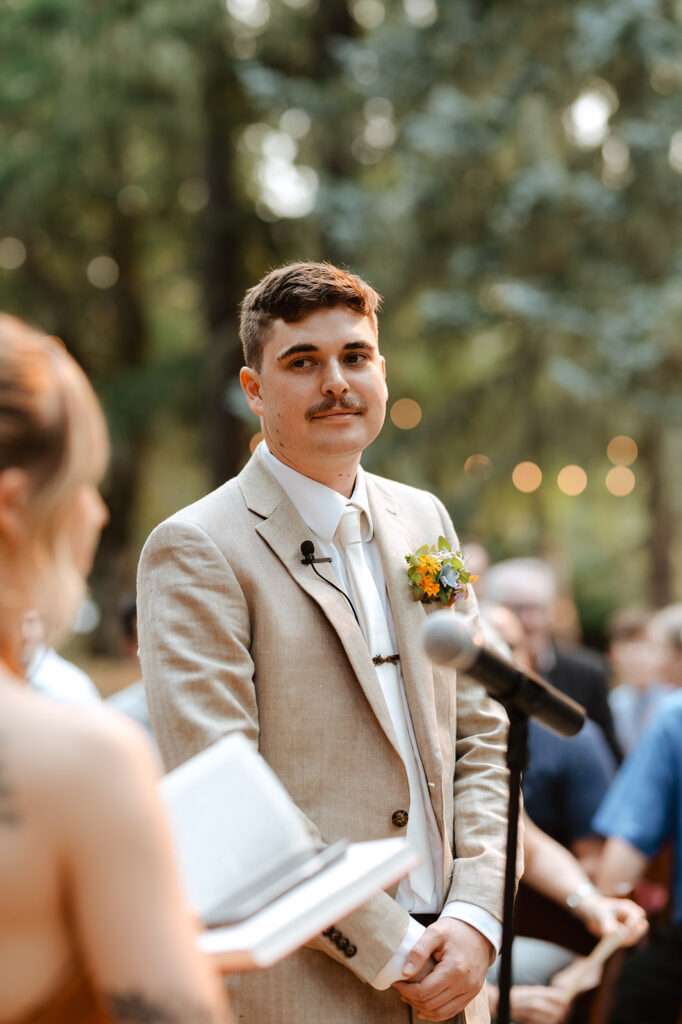 groom at wedding ceremony at oregon forest wedding at mount Tom House